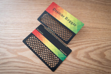 Two metal member cards with QR coupon codes and "Positive Reggae" design.