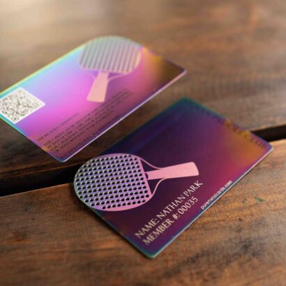 Metal member cards for a ping pong club, showing iridescent finish and club logo. Text: "Nathan Park, Member #00035
