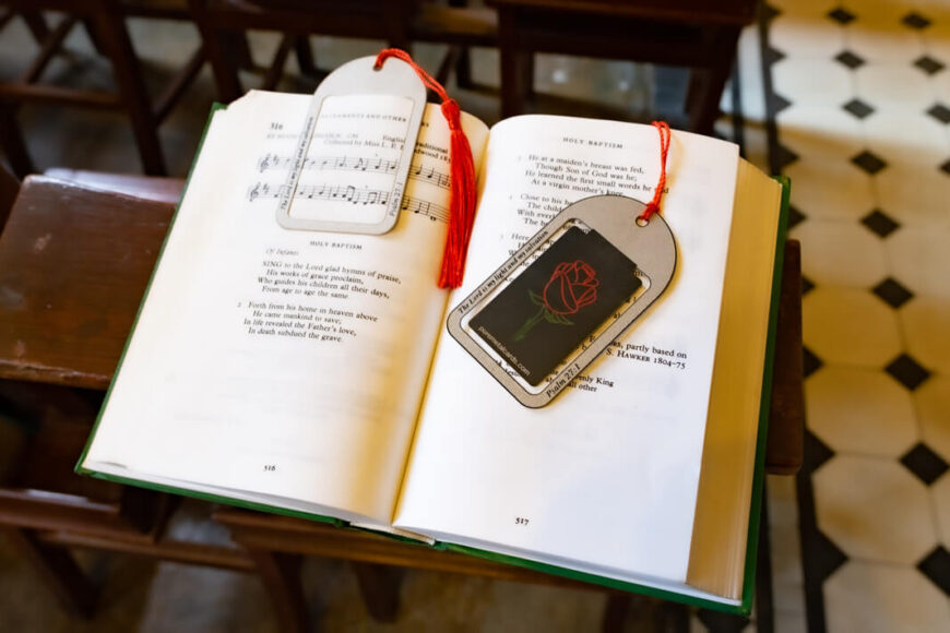 Metal bookmarks in a church hymnal, showcasing elegant designs.