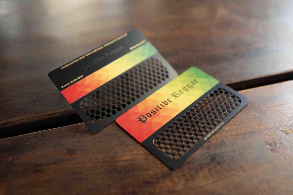 Metal grinder cards with "Positive Reggae" design and the color scheme of red, yellow and green from Pure Metal Cards.