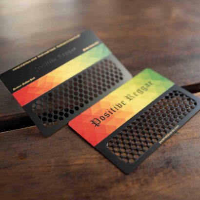 Metal grinder cards with "Positive Reggae" design and the color scheme of red, yellow and green from Pure Metal Cards.