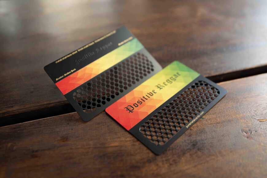 Metal grinder cards with "Positive Reggae" design and the color scheme of red, yellow and green from Pure Metal Cards.