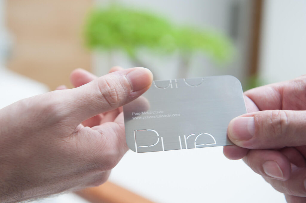 Pure_Metal_Cards_Metal_Business_Card being handed out