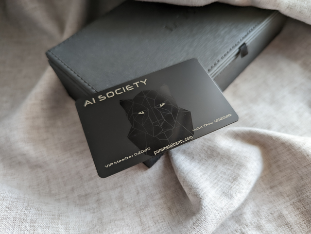 laser engraved metal business card with AI Society logo and panther design by pure metal cards